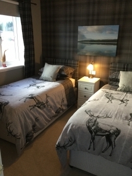 Twin bedroom with great views of the Cairngorms